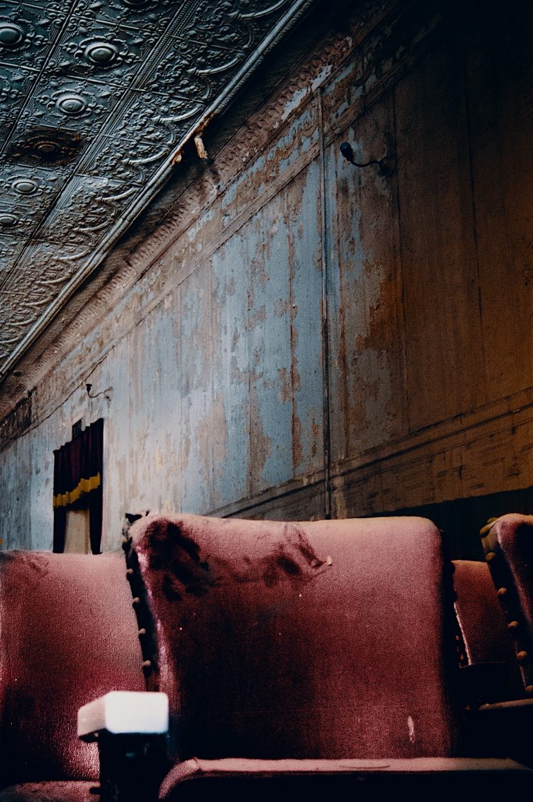 Closeup of red seat with white arm rest