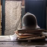 Helmet on old papers