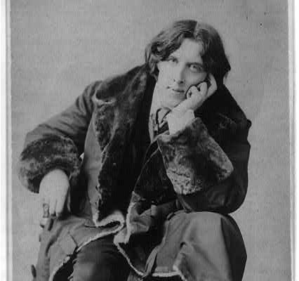 Oscar Wilde seated with his hand resting against his cheek, photographed by Napoleon Sarony in 1882