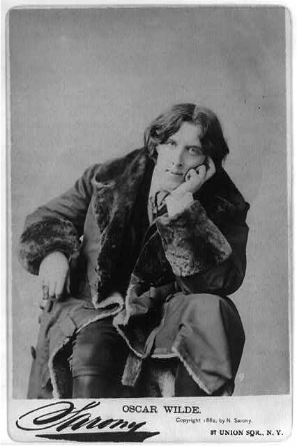 Oscar Wilde seated with his hand resting against his cheek, photographed by Napoleon Sarony in 1882